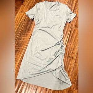 Medium fitted cinched on the left side.  Pair with tennis shoes